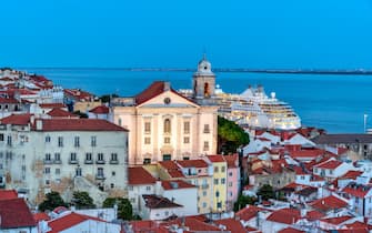 View of the typical Alfama neighborhood in Lisbon, Portugal - dome of the national pantheon