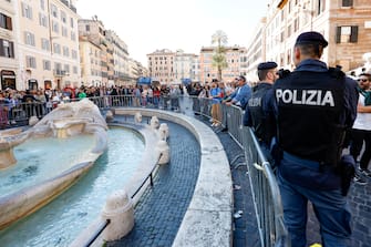 Steel interlocking barricades are placed around the Barcaccia fountain ahead of the Europa League soccer match between Roma and Feyenoord Rotterdam, in Rome, Italy, 20 April 2023. ANSA/FABIO FRUSTACI