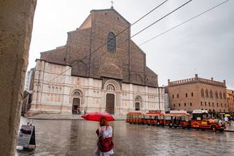 Piazza Maggiore  in Bologna in September 2022 during a thunderstorm, passers-by cover themselves from the rain with umbrellas.  (Photo by Riccardo Fabi/NurPhoto via Getty Images)