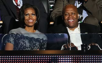 CHARLOTTE, NC - SEPTEMBER 05:  First lady Michelle Obama sits with her brother Craig Robinson in a box during day two of the Democratic National Convention at Time Warner Cable Arena on September 5, 2012 in Charlotte, North Carolina. The DNC that will run through September 7, will nominate U.S. President Barack Obama as the Democratic presidential candidate.  (Photo by Alex Wong/Getty Images)