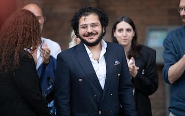 Patrick Zaki, the Egyptian activist, graduated from the University of Bologna, in Piazza Maggiore, at the party for his return, Bologna, 30 July 2023. "I thank the whole city, which allowed my liberation. This is a city of freedom and human rights. I am happy to be here in person, finally, after years of online calls," he said.    ANSA / MAX CAVALLARI