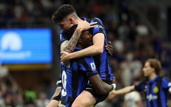 Inter Milan’s Marcus Thuram (L)  jubilates with his teammate  Alessandro Bastoni  after scoring goal of 1 to 0 during the Italian serie A soccer match between Fc Inter  and Cagliari  at  Giuseppe Meazza stadium in Milan, 14 April 2024.
ANSA / MATTEO BAZZI