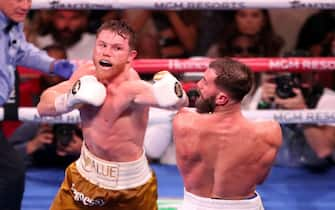 (L-R) Canelo Alvarez punches Caleb Plant during their WBA/WBC/WBO super-middleweight 168-pound title fight at the MGM Grand Garden Arena on November 6, 2021, in Las Vegas, NV, USA. Photo by Alejandro Salazar/PxImages/ABACAPRESS.COM