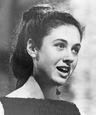 16 year-old Italian singer Gigliola Cinquetti singing the winning song, song 'Non ho l'eta', at the Eurovision Song Contest, held at the Tivolis Koncertsal, Copenhagen, 21st March 1964. (Photo by Keystone/Hulton Archive/Getty Images)