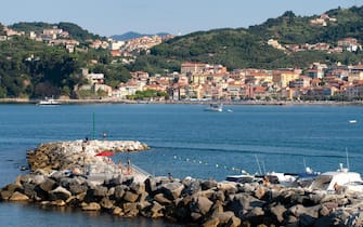 LERICI, LIGURIA, ITALY - AUGUST 18, 2018: View across the bay of popular tourist destination of Lerici to San Terenzo village. Mediterranean coast, Italy. Busy sunny summer day.