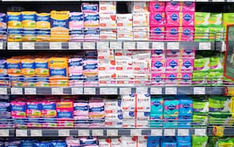 Minsk, Belarus - September 27, 2019: Counter with various feminine sanitary pads in a supermarket.