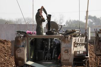 epa11052153 An Israeli soldier loads a guided mortar munition system at an area near the border with the Gaza Strip, in southern Israel, 01 January 2024. More than 21,600 Palestinians and at least 1,300 Israelis have been killed, according to the Palestinian Health Ministry and the Israel Defense Forces (IDF), since Hamas militants launched an attack against Israel from the Gaza Strip on 07 October, and the Israeli operations in Gaza and the West Bank which followed it. The Israeli military stated that its ground, air, and naval troops are 'continuing to conduct joint combat' across the Gaza Strip.  EPA/ABIR SULTAN