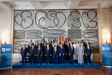 Italian Prime Minister Giorgia Meloni, flanked by her deputies Foreign Minister Antonio Tajani (C-L) and Infrastructure and Transport Minister Matteo Salvini, poses for a family photo with heads of state and other participants at the International Conference on Development and Migration, at the Farnesina in Rome, Italy, 23 July 2023. The international conference, an initiative of the Italian Government, gathered leaders from the enlarged Mediterranean region as well as EU member states and partners from the Sahel and the Horn of Africa, together with the heads of European institutions and international financial institutions, in Rome to address emergencies and launch a shared development strategy for the implementation of measures for growth and development in the wider Mediterranean and Africa, addressing the migration crisis, environment, energy diversification and climate change, among other topics.ANSA/ UFFICIO STAMPA PALAZZO CHIGI/ FILIPPO ATTILI +++ ANSA PROVIDES ACCESS TO THIS HANDOUT PHOTO TO BE USED SOLELY TO ILLUSTRATE NEWS REPORTING OR COMMENTARY ON THE FACTS OR EVENTS DEPICTED IN THIS IMAGE; NO ARCHIVING; NO LICENSING +++ NPK +++