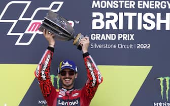 epa10109994 Italian Francesco Bagnaia of Ducati Lenovo Team celebrates on the podium after winning the Moto GP during the Motorcycling British Grand Prix at the Silverstone Circuit race track in Silverstone, Britain, 07 August 2022.  EPA/ANDREW YATES