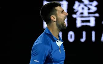 epa11085111 Novak Djokovic of Serbia celebrates match point during his round 2 win over Alexei Popyrin of Australia on Day 4 of the 2024 Australian Open at Melbourne Park in Melbourne, Australia, 17 January 2024.  EPA/JAMES ROSS  AUSTRALIA AND NEW ZEALAND OUT