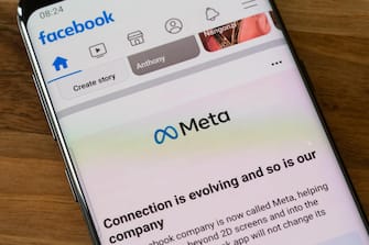 Facebook has rebranded itself as Meta - the brand covers the Facebook, Messenger, Instagram and WhatsApp apps - shown on a smartphone screen. UK