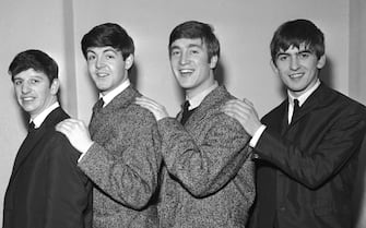 The Beatles, early group portrait, (L-R) Ringo Starr, Paul McCartney, John Lennon, George Harrison - posed, backstage, circa 1962. (Photo by Harry Hammond/V&A Images/Getty Images)