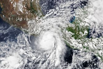 - Mexico, Mexico -20220601-

This satellite image shows Hurricane Agatha strike western Mexico, near Puerto Escondido, with maximum sustained winds of 105 miles (169 kilometers) per hour on 30 May  2022. 
That made the category 2 storm the strongest May hurricane to make landfall along the Pacific coast of Mexico since modern record keeping began in 1949, according to America’s National Hurricane Center.
The Visible Infrared Imaging Radiometer Suite (VIIRS) on the NOAA-20 satellite acquired this natural-color image of the storm at 1:35 p.m. local time (19:35 Universal Time) on May 30, 2022, a few hours before the storm made landfall. Agatha brought intense downpours and howling winds to several tourist beaches and fishing towns in an otherwise sparsely populated region before weakening rapidly as it moved northward over the mountainous terrain of southern Mexico.
Prevailing trade winds typically steer west and out to sea, but in this case a low-pressure trough dipped far enough south to pull Agatha toward land, reported meteorologist Jeff Masters for Yale Climate Connections. Hurricane forecasters are watching the possibility that Agatha’s remnants will become more organized and strengthen over the Gulf of Mexico as they move toward Florida.
The eastern Pacific hurricane season officially runs from May 15 through November 30. The peak months of the season are July through September. NOAA’s seasonal outlook for the eastern Pacific hurricane season in 2022 indicates that a below-normal season is likely, while the seasonal outlook for the Atlantic Ocean predicts a more active season than normal. The ongoing La Niña and resulting changes in vertical wind shear in key regions of hurricane formation and development are one of the key factors behind these forecasts.

-PICTURED: General View (Hurricane Agatha Hits Mexico`s Pacific Coast0
-PHOTO by: NASA Earth Observatory/Cover Images/INSTARimages.com
-51623320.jpg

This is an editorial, rights-managed image. Please contact Instar Images LLC for licensing fee and rights information at sales@instarimages.com or call +1 212 414 0207 This image may not be published in any way that is, or might be deemed to be, defamatory, libelous, pornographic, or obscene. Please consult our sales department for any clarification needed prior to publication and use. Instar Images LLC reserves the right to pursue unauthorized users of this material. If you are in violation of our intellectual property rights or copyright you may be liable for damages, loss of income, any profits you derive from the unauthorized use of this material and, where appropriate, the cost of collection and/or any statutory damages awarded