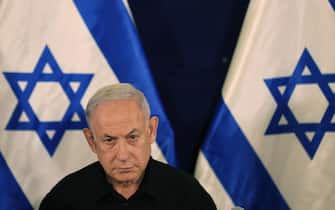 epa10945792 Israel's Prime Minister Benjamin Netanyahu addresses a press conference in The Kirya military base in Tel Aviv, Israel, 28 October 2023.  EPA/ABIR SULTAN / POOL