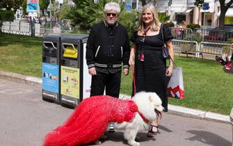 CANNES, FRANCE - MAY 17: Pedro Almodovar is seen posing for a picture with a fan outside "Le Majestic" Hotel  during the 76th Cannes film festival on May 17, 2023 in Cannes, France. (Photo by Pierre Suu/GC Images)