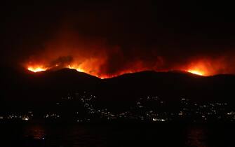 epa10765082 A general view of a wildfire burning on the Pantokratoras  mountain on Corfu island, Greece, 23 July 2023. A fire broke out in the northern part of the island of Corfu. A message was sent via the emergency number 112 for the evacuation of the areas Santa, Megoula, Porta, Palia Perithia and Sinies.  EPA/STAMATIS KATAPODIS
