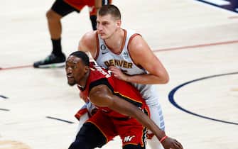 DENVER, COLORADO - JUNE 12: Nikola Jokic #15 of the Denver Nuggets defends against Bam Adebayo #13 of the Miami Heat during the first quarter in Game Five of the 2023 NBA Finals at Ball Arena on June 12, 2023 in Denver, Colorado. NOTE TO USER: User expressly acknowledges and agrees that, by downloading and or using this photograph, User is consenting to the terms and conditions of the Getty Images License Agreement. (Photo by Justin Edmonds/Getty Images)