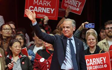 TOPSHOT - Canada's Prime Minister and Liberal Party leader Mark Carney waves to supporters at a victory party in Ottawa, Ontario on April 29, 2025. Prime Minister Mark Carney won Canada's election on April 28, 2025, leading his Liberal Party to a new term in power after convincing voters his experience managing crises had prepared him to confront US President Donald Trump. (Photo by Dave Chan / AFP) (Photo by DAVE CHAN/AFP via Getty Images)          