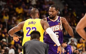 PALM SPRINGS, CA - OCTOBER 19: LeBron James #23 of the Los Angeles Lakers and Kevin Durant #35 of the Phoenix Suns embrace before the game on October 19, 2023 at the Acrisure Arena in Palm Springs, California. NOTE TO USER: User expressly acknowledges and agrees that, by downloading and/or using this Photograph, user is consenting to the terms and conditions of the Getty Images License Agreement. Mandatory Copyright Notice: Copyright 2023 NBAE (Photo by Adam Pantozzi/NBAE via Getty Images)