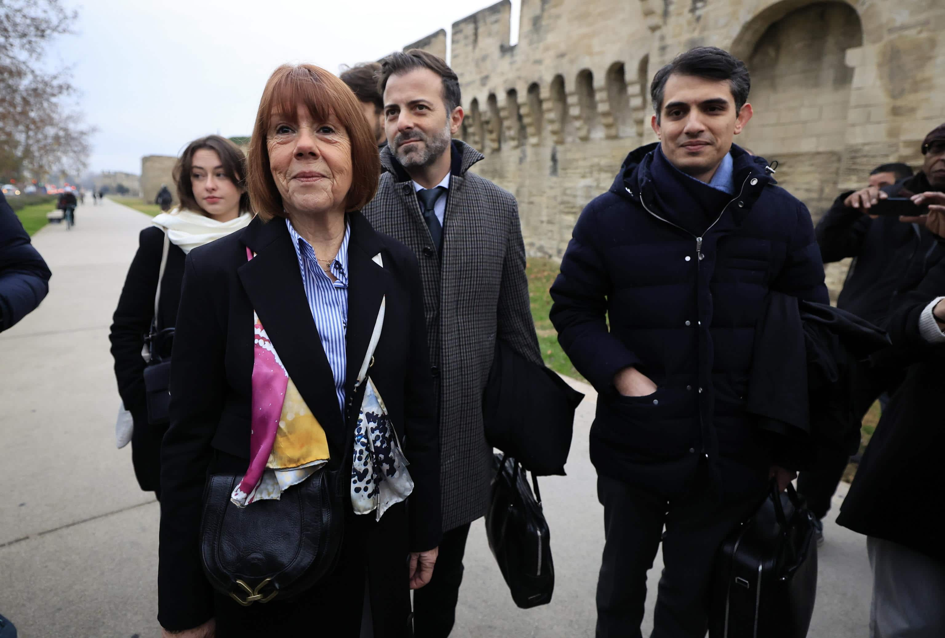 epa11784905 Gisele Pelicot (L), escorted by her lawyers Stephane Babonneau (R) and Antoine Camus (C), arrive at the criminal court where her husband Dominique Pelicot is on trial in Avignon, South of France, 19 December 2024. Judges will hand down verdicts on 51 men in the mass rape trial in which Dominique Pelicot is accused of drugging and raping his then-wife, Gisele Pelicot as well as inviting dozens of men to rape her while she was unconscious at their home in Mazan, France, between 2011 and 2020.  EPA/GUILLAUME HORCAJUELO