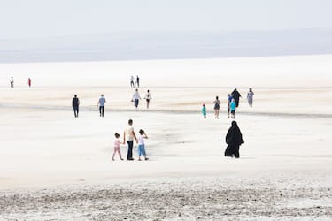People visit the dried-up Lake Tuz (Salt) in Ankara, Turkey, on Saturday, August 28, 2021.(Photo by: Halil Ibrahim Ayan/GocherImagery/Universal Images Group via Getty Images)