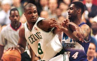 BOSTON, UNITED STATES:  Utah Jazz (#34) Chris Morris (R) defends against a drive by Boston Celtics Antoine Walker in the first half of action 04 March at the Fleet Center in Boston, MA.                                                   AFP PHOTO JOHN MOTTERN (Photo credit should read JOHN MOTTERN/AFP via Getty Images)
