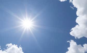 Brillant sun shining in blue sky overhead in southwest Florida USA