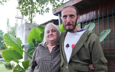 epa03629767 Youngest sister of Pope Francis, 65 Maria Elena Bergoglio (L), poses with her son, Jorge Vallejos (R), godson of Pope, in Buenos Aires, on 17 March 2013. Maria Elena, who will not attend the Mass for the assumption of the new pope at the Vatican on March 19, referred to former Cardinal Jorge Mario Bergoglio as a "very good brother, companion, very good person".  EPA/Enrique Garcia Medina
