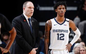 MEMPHIS, TN - JANUARY 28: Ja Morant #12 of the Memphis Grizzlies talks to head coach Taylor Jenkins during a game against the Denver Nuggets at FedExForum on January 28, 2020 in Memphis, Tennessee. Memphis defeated Denver 104-96. NOTE TO USER: User expressly acknowledges and agrees that, by downloading and or using this Photograph, user is consenting to the terms and conditions of the Getty Images License Agreement. (Photo by Joe Robbins/Getty Images)