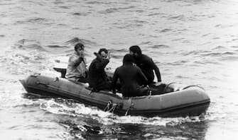 Roger Chapman (second left) waves as he is taken to the Vickers Voyager, after being released from the crippled miniature submarine Pisces III, which ahd been hauled over 1,000ft from the Atlantic seabed off Cork.   (Photo by PA Images via Getty Images)
