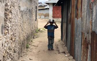 Little boy in African village