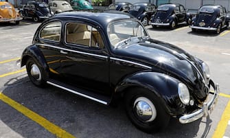 epa07779143 Different versions of classic Volkswagen Bettle cars are on display at the Beetle Pageant 2019 in Colombo, Sri Lanka, 18 August 2019. The Sri Lankan 'Volkswagen Beetle Ownersâ Club' organized the pageant. The Volkswagen (VW) Beetle has been a popular car in the island since the early 1950s and even now there are many which have been single owned or passed down to the second generation.  EPA/M.A.PUSHPA KUMARA