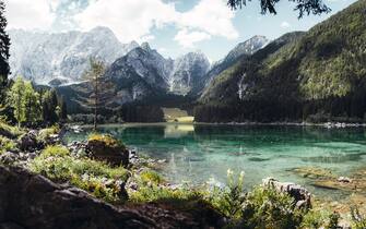 Idyllic lake in slovenia with mountain range
