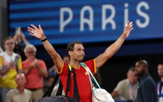 epa11652016 (FILE) - Rafael Nadal of Spain waves to the crowd as he leaves after losing the Men's Doubles Quarter-final match with teammate Carlos Alcaraz against Austin Krajicek and Rajeev Ram of the US at the Tennis competitions in the Paris 2024 Olympic Games, at the Roland Garros in Paris, France, 31 July 2024 (reissued 10 October 2024). On 10 October 2024, Rafael Nadal of Spain announced that he will retire from professional tennis. Since winning his first ever title in 2004, Nadal won 92 titles, including 22 grand slams and a record 14 French Open titles.  EPA/Daniel Irungu