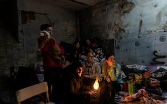 Janna Goma, right, with her family settle in a bomb shelter in Mariupol, Ukraine, Sunday, March 6, 2022. 