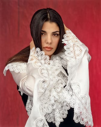 Italian actress and singer Mietta (Daniela Miglietta) posing with her hands in her hair. Italy, 1993. (Photo by Rino Petrosino/Mondadori via Getty Images)