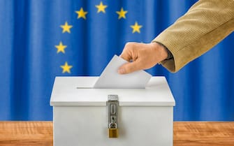 man throws ballot paper in electoral roll - european union