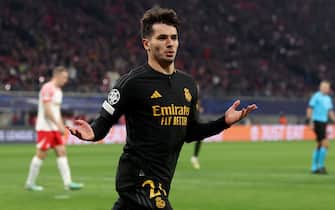 LEIPZIG, GERMANY - FEBRUARY 13: Brahim Diaz of Real Madrid celebrates scoring his team's first goal during the UEFA Champions League 2023/24 round of 16 first leg match between RB Leipzig and Real Madrid CF at Red Bull Arena on February 13, 2024 in Leipzig, Germany. (Photo by Alexander Hassenstein/Getty Images)