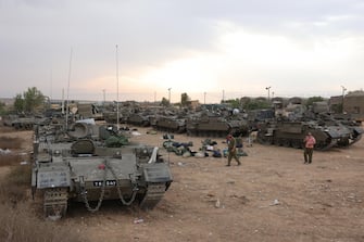 epa10909666 Israeli reservists prepare next to armored personnel carriers (APCs) at a military camp near Beer Sheva, Israel, 09 October 2023. Israeli chief military spokesperson Rear-Admiral Daniel Hagari said on 09 October that the country had drafted a record of 300,000 reservists. More than 700 Israelis were killed and over 2,000 were injured since the Islamist movement Hamas carried out an unprecedented attack on southern Israel on 07 October, the Israeli army said. According to Palestinian officials, more than 500 people were killed and nearly 3,000 were injured as a result of Israel s retaliatory raids and air strikes in the Palestinian enclave.  EPA/ABIR SULTAN