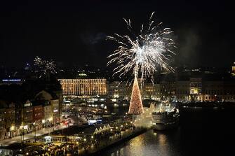 New years eve celebrations with fireworks over the Skepsbron street in central Stockholm at midnight December 31, 2013 / January 1, 2014.       AFP PHOTO / TT NEWS AGENCY / ANDERS WIKLUND / SWEDEN OUT        (Photo credit should read ANDERS WIKLUND/AFP via Getty Images)