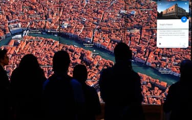 A person looks at a Google Earth map of Venice, Italy on a screen as Google Earth unveils the revamped version of the application April 18, 2017 at a event at New York's Whitney Museum of Art.
Google on Tuesday launched a re-imagined version of its free Earth mapping service, weaving in storytelling and artificial intelligence and freeing it from apps. / AFP PHOTO / TIMOTHY A. CLARY        (Photo credit should read TIMOTHY A. CLARY/AFP via Getty Images)