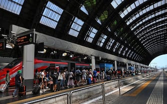 This photograph taken on July 7, 2023 shows a Freccia Rossa (Red Arrow) high-speed train of Trenitalia train operator at the central railway station in Milan. (Photo by GABRIEL BOUYS / AFP) (Photo by GABRIEL BOUYS/AFP via Getty Images)