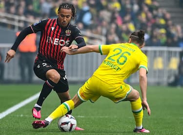 Nices French midfielder Alexis Beka Beka (L) fights for the ball with Nantes' French defender Jaouen Hadjam (R) during the French L1 football match between FC Nantes and OGC Nice at the Stade de la BeaujoireLouis Fonteneau in Nantes, western France on March 12, 2023. (Photo by Sebastien SALOM-GOMIS / AFP) (Photo by SEBASTIEN SALOM-GOMIS/AFP via Getty Images)