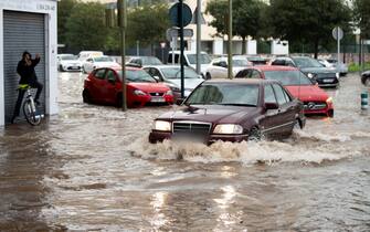 epa11693651 Vehicles drive through flood water following heavy rainfalls in Castellon de la Plana, Valencia, Spain, 31 October 2024. At least 95 people died in the province of Valencia and neighboring provinces following floods caused by the DANA (high-altitude isolated depression) phenomenon impacting the eastern part of the country.  EPA/ANDREU ESTEBAN