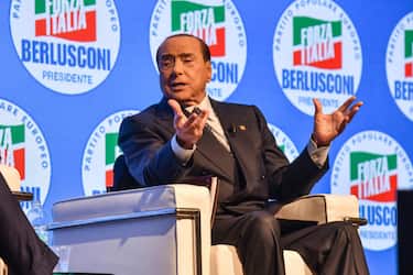 Leader of Italian right-wing party "Forza Italia", Silvio Berlusconi gets up from his chair to acknowledge applause on stage on September 23, 2022 at the Manzoni theater in Milan during a meeting closing his party's campaign for the September 25 general election. ANSA/MATTEO CORNER