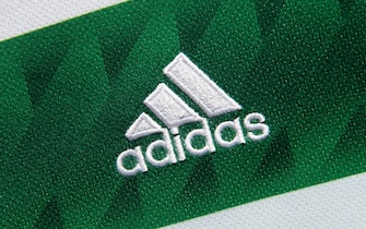 MANCHESTER, ENGLAND - FEBRUARY 06: The adidas logo on the official Glasgow Celtic FC home shirt on February 6, 2023 in Manchester, United Kingdom. (Photo by Visionhaus/Getty Images)