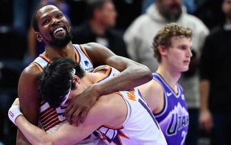 SALT LAKE CITY, UTAH - NOVEMBER 17: Kevin Durant #35 hugs Yuta Watanabe #18 of the Phoenix Suns after an NBA In-Season Tournament game against the Utah Jazz at Delta Center on November 17, 2023 in Salt Lake City, Utah. NOTE TO USER: User expressly acknowledges and agrees that, by downloading and or using this photograph, User is consenting to the terms and conditions of the Getty Images License Agreement. (Photo by Alex Goodlett/Getty Images)