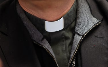 Catholic priest. Clerical collar. Switzerland.