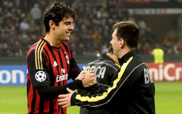 AC Milan's Brazilian forward Kaka (L) skakes hand with Barcelona's Argentinian forward Lionel Messi before the Champion's League football match AC Milan vs FC Barcelona, on October 22, 2013 in San Siro Stadium in Milan.    AFP PHOTO / OLIVIER MORIN        (Photo credit should read OLIVIER MORIN/AFP via Getty Images)