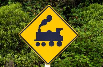 NORTH ISLAND, NEW ZEALAND - DECEMBER 11:  Road traffic sign look out for trains on railway crossing, North Island, New Zealand.  (Photo by Tim Graham/Getty Images)